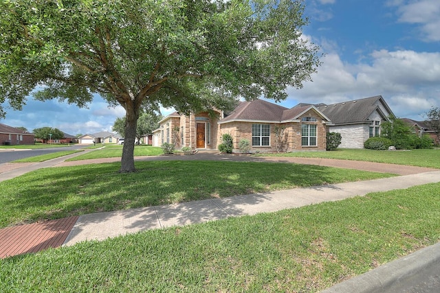 6613 Belvoir Ave, Corpus Christi, TX 78414 - view of front facade with a front lawn and brick siding