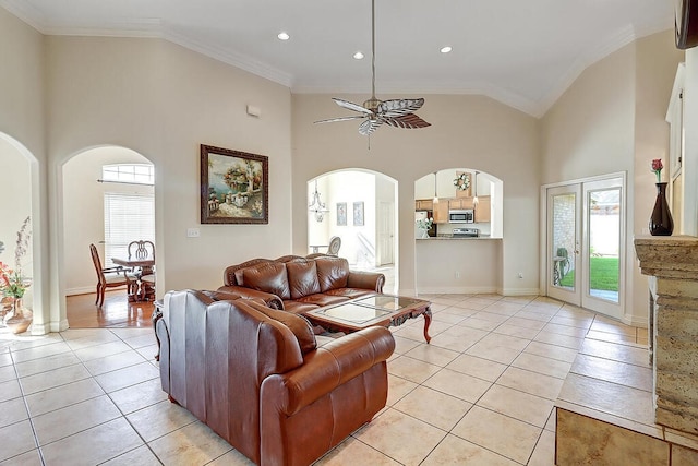 6613 Belvoir Ave, Corpus Christi, TX 78414 - living area with light tile patterned flooring, a ceiling fan, high vaulted ceiling, crown molding, and arched walkways