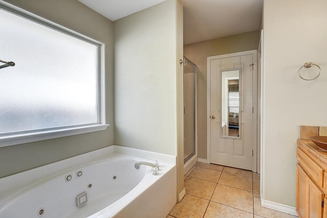 6613 Belvoir Ave, Corpus Christi, TX 78414 - bathroom featuring plenty of natural light, a whirlpool tub, tile patterned floors, and a stall shower