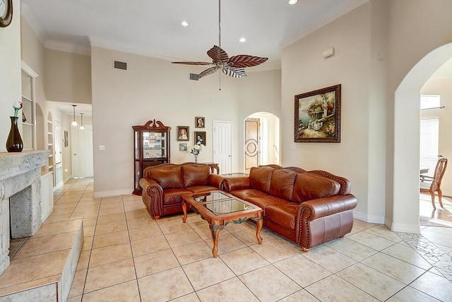 6613 Belvoir Ave, Corpus Christi, TX 78414 - living area with a ceiling fan, arched walkways, a towering ceiling, light tile patterned flooring, and recessed lighting