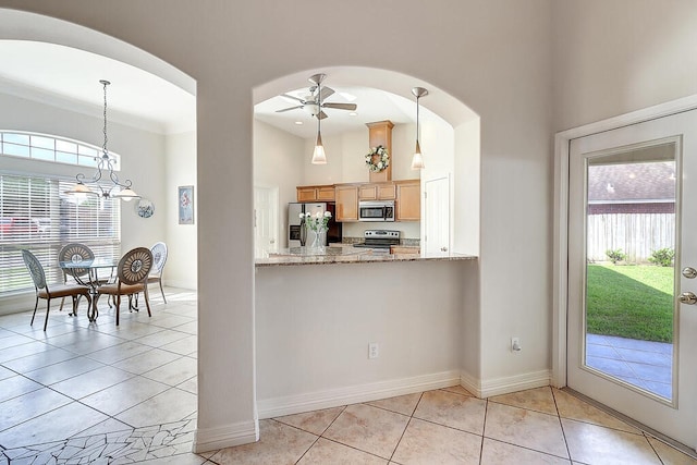 6613 Belvoir Ave, Corpus Christi, TX 78414 - kitchen featuring appliances with stainless steel finishes, arched walkways, a ceiling fan, pendant lighting, and a high ceiling