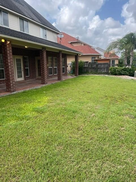 8038 Bar Le Doc Dr, Corpus Christi, TX 78414 - view of yard featuring a patio