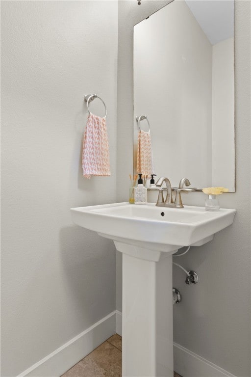 bathroom featuring tile patterned flooring and sink