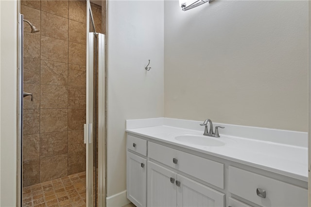 bathroom featuring walk in shower and vanity