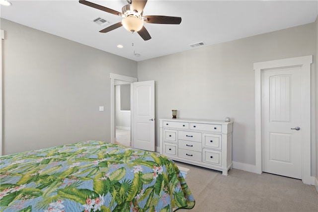 bedroom with ceiling fan and light colored carpet