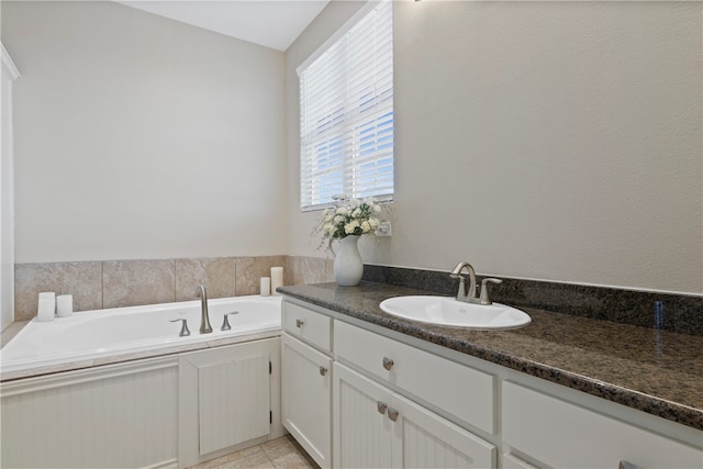 bathroom featuring vanity and a bathing tub