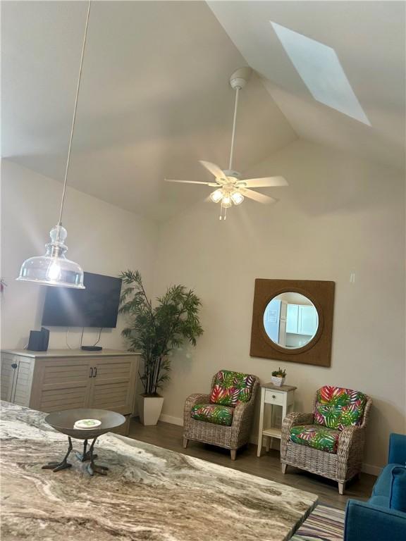 15110 Arashi Beach Dr, Corpus Christi, TX 78418 - living area with a skylight, ceiling fan, high vaulted ceiling, and wood finished floors