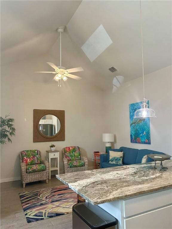 15110 Arashi Beach Dr, Corpus Christi, TX 78418 - living area with high vaulted ceiling, ceiling fan, and wood finished floors