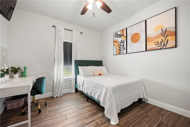 1570 Maryville Loop, Beeville, TX 78102 - bedroom featuring wood finished floors, a ceiling fan, and baseboards