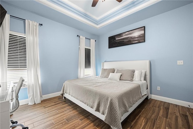 1570 Maryville Loop, Beeville, TX 78102 - bedroom featuring a raised ceiling, wood finished floors, and baseboards