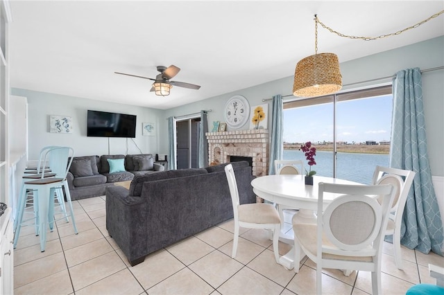 15225 Leeward Dr Unit 2A, Corpus Christi, TX 78418 - living room with ceiling fan, a fireplace, and light tile patterned floors