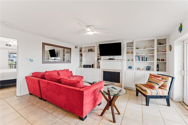 700 Island Retreat Rd Unit 138, Port Aransas, TX 78373 - living area featuring a ceiling fan, light tile patterned floors, plenty of natural light, and a fireplace