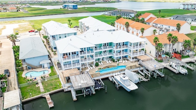 birds eye view of property featuring a water view