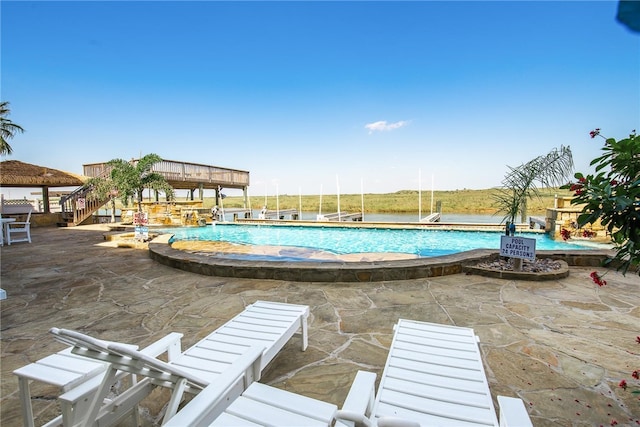 view of swimming pool featuring a gazebo, a jacuzzi, and a patio area