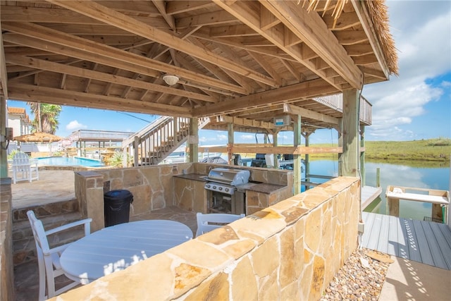 dock area featuring a water view