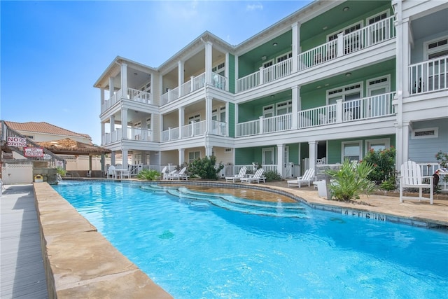 view of pool featuring a patio