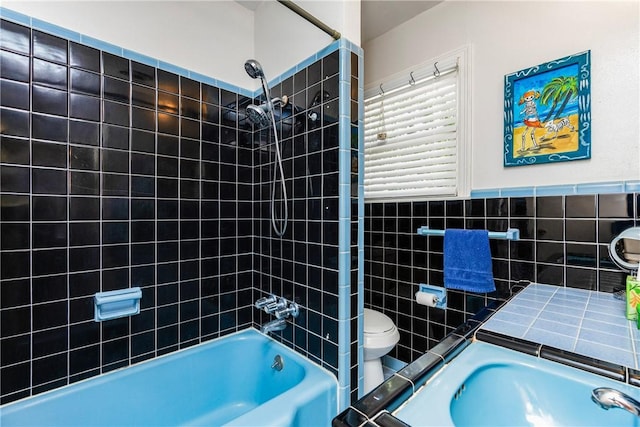 4009 Pope Dr, Corpus Christi, TX 78411 - bathroom with shower / bathtub combination and tile walls