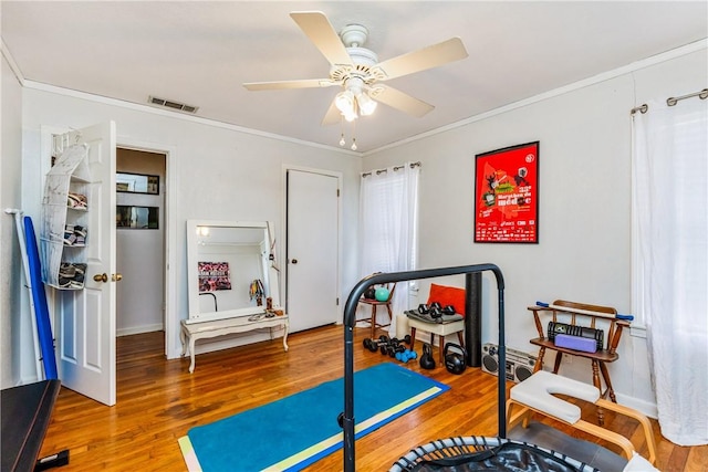 4009 Pope Dr, Corpus Christi, TX 78411 - workout room with wood finished floors, ornamental molding, and a ceiling fan