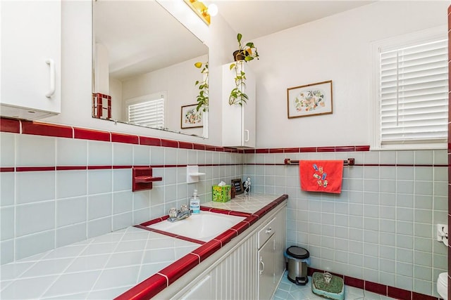 4009 Pope Dr, Corpus Christi, TX 78411 - bathroom featuring vanity and wainscoting