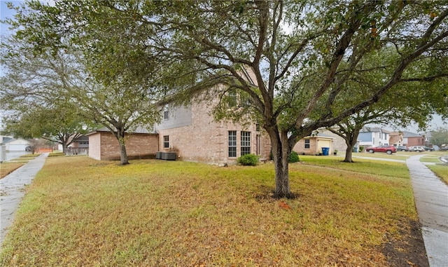 view of property exterior featuring a lawn