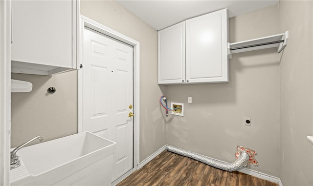 laundry room featuring sink, hookup for a washing machine, cabinets, dark hardwood / wood-style flooring, and hookup for an electric dryer