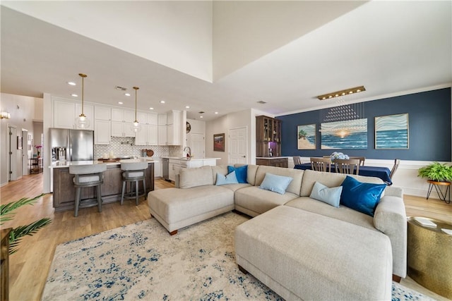 living room with recessed lighting and light wood-type flooring