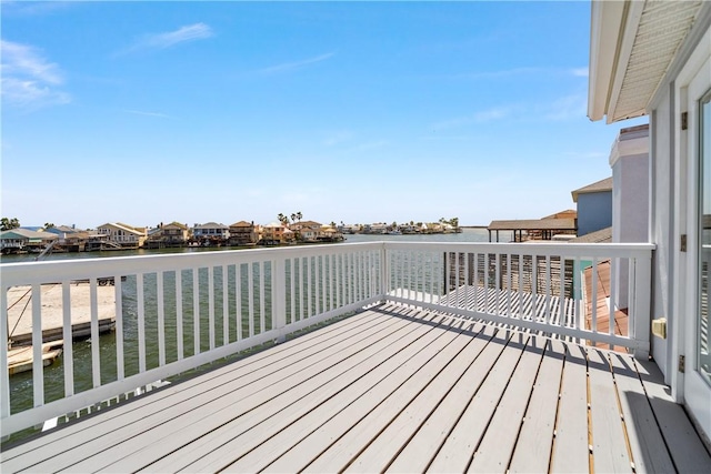 wooden deck with a water view
