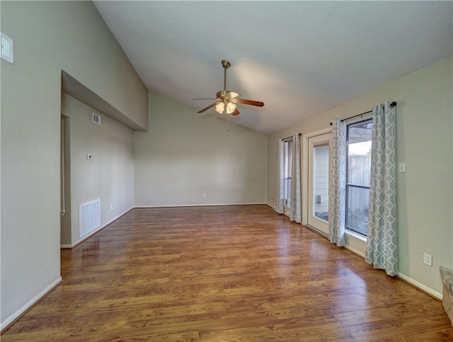 unfurnished room with vaulted ceiling, ceiling fan, and hardwood / wood-style flooring