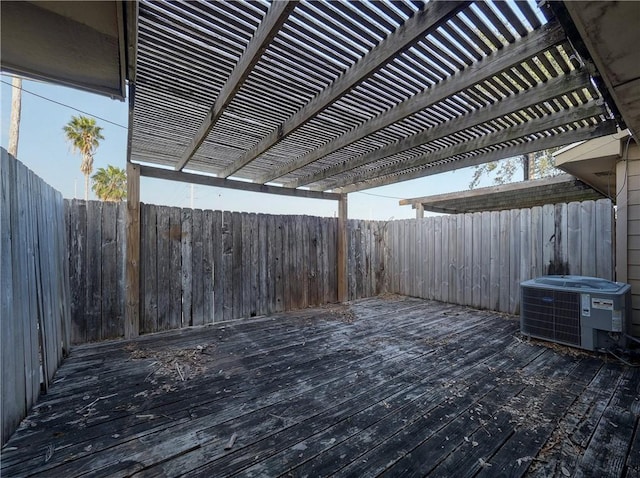 7140 Premont Dr Unit 12, Corpus Christi, TX 78414 - wooden terrace with central air condition unit, fence, and a pergola