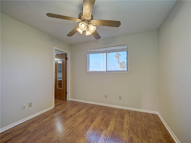 spare room with hardwood / wood-style floors, a textured ceiling, and ceiling fan