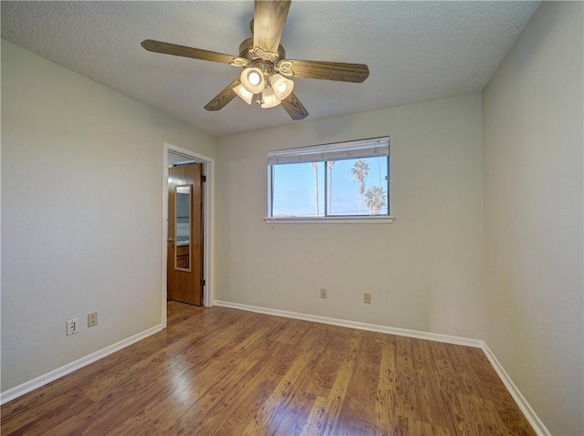 7140 Premont Dr Unit 12, Corpus Christi, TX 78414 - unfurnished room featuring wood finished floors, baseboards, a ceiling fan, and a textured ceiling