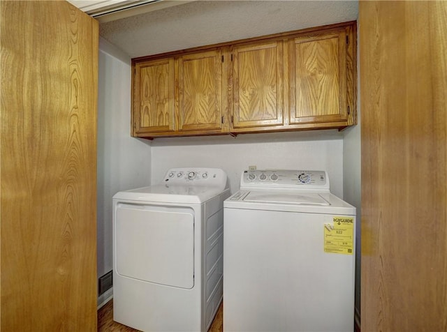 7140 Premont Dr Unit 12, Corpus Christi, TX 78414 - laundry area with washer and dryer and cabinet space