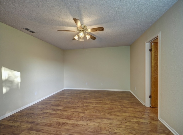 unfurnished room with wood-type flooring, a textured ceiling, and ceiling fan