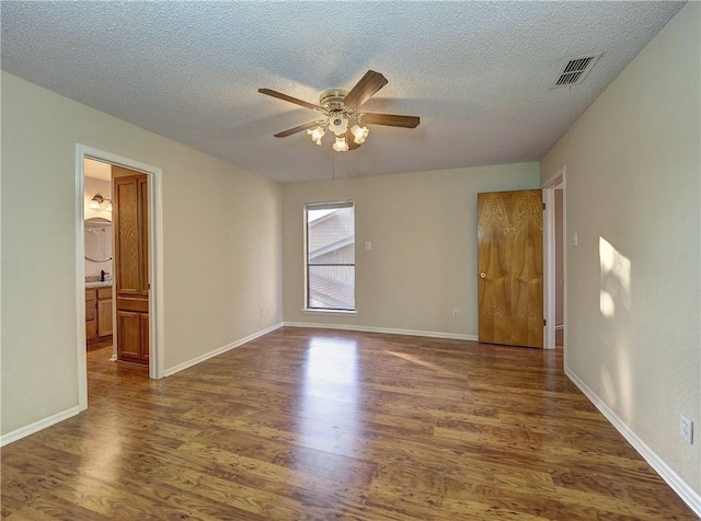 7140 Premont Dr Unit 12, Corpus Christi, TX 78414 - unfurnished room featuring wood finished floors, a ceiling fan, a textured ceiling, and baseboards