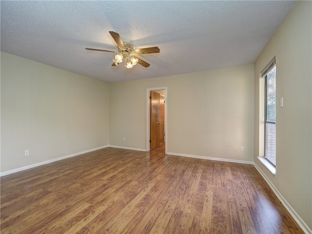 unfurnished room featuring a textured ceiling, hardwood / wood-style flooring, and ceiling fan