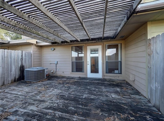 7140 Premont Dr Unit 12, Corpus Christi, TX 78414 - wooden terrace featuring central AC unit, fence, and a pergola