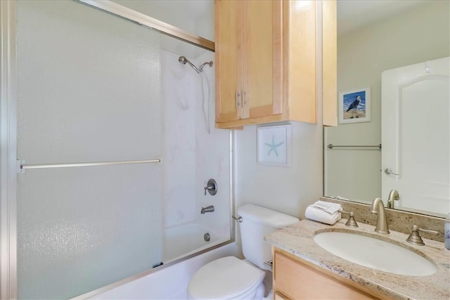 full bathroom with shower / bath combination with glass door, vanity, and toilet