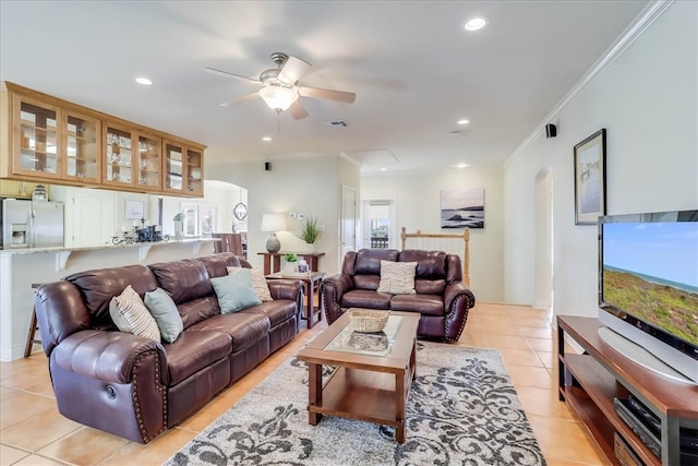 living room with crown molding, light tile patterned flooring, a healthy amount of sunlight, and ceiling fan