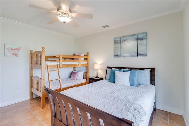 bedroom with ceiling fan, light tile patterned flooring, and ornamental molding