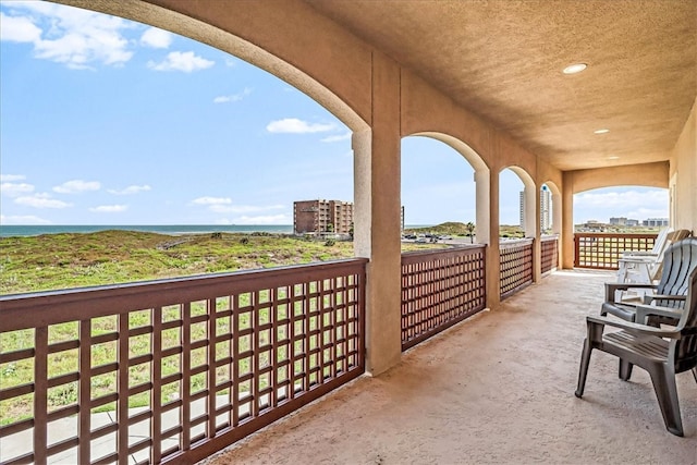 balcony featuring a water view