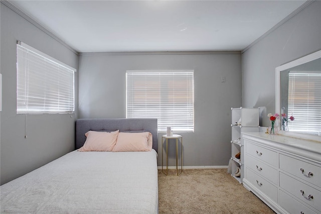 bedroom with ornamental molding and light carpet