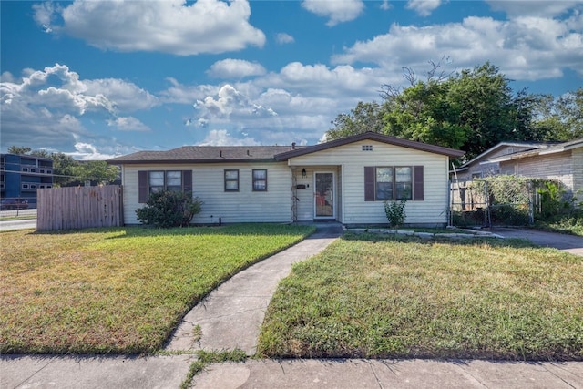 ranch-style home with a front lawn