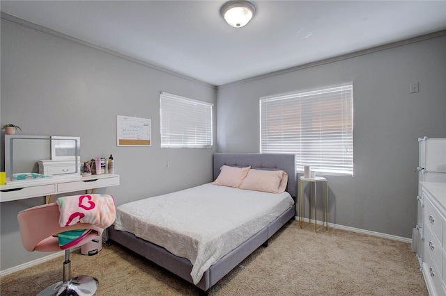 carpeted bedroom with ornamental molding