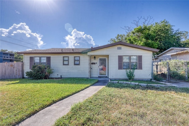 single story home featuring a front yard