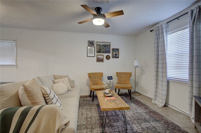 tiled living room featuring ceiling fan