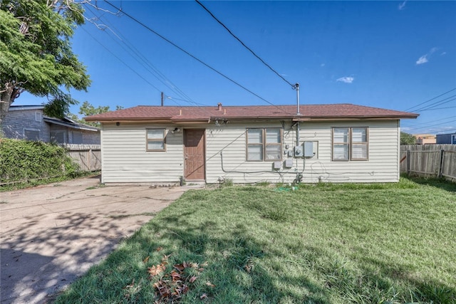 back of property with a patio and a yard