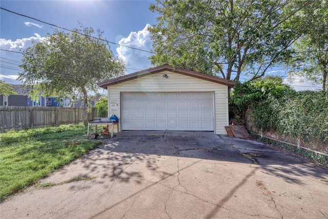 garage featuring a yard