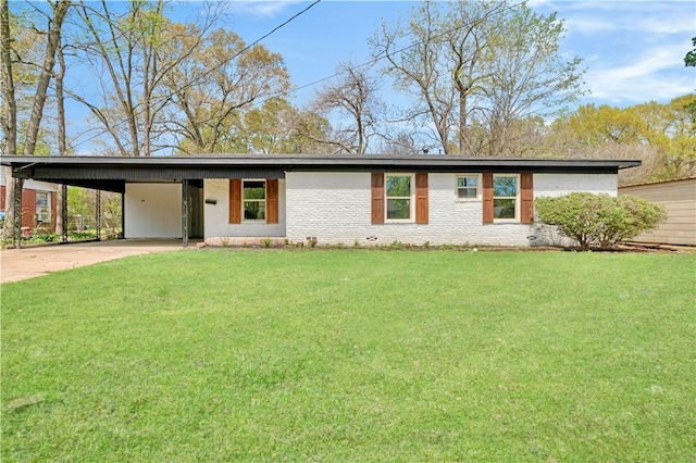 2121 Cedar St, Paris, TX 75460 - mid-century modern home with concrete driveway, an attached carport, a front lawn, and brick siding