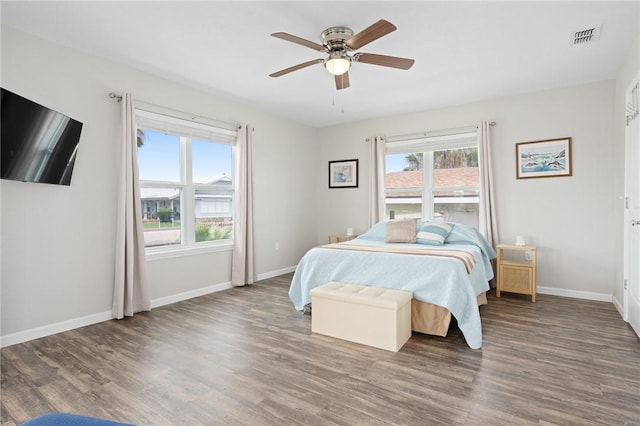 219 Pintail Ln, Rockport, TX 78382 - bedroom with wood finished floors, baseboards, and a ceiling fan