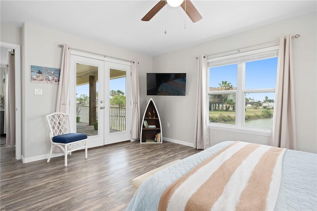 219 Pintail Ln, Rockport, TX 78382 - bedroom with french doors, access to outside, multiple windows, and wood finished floors
